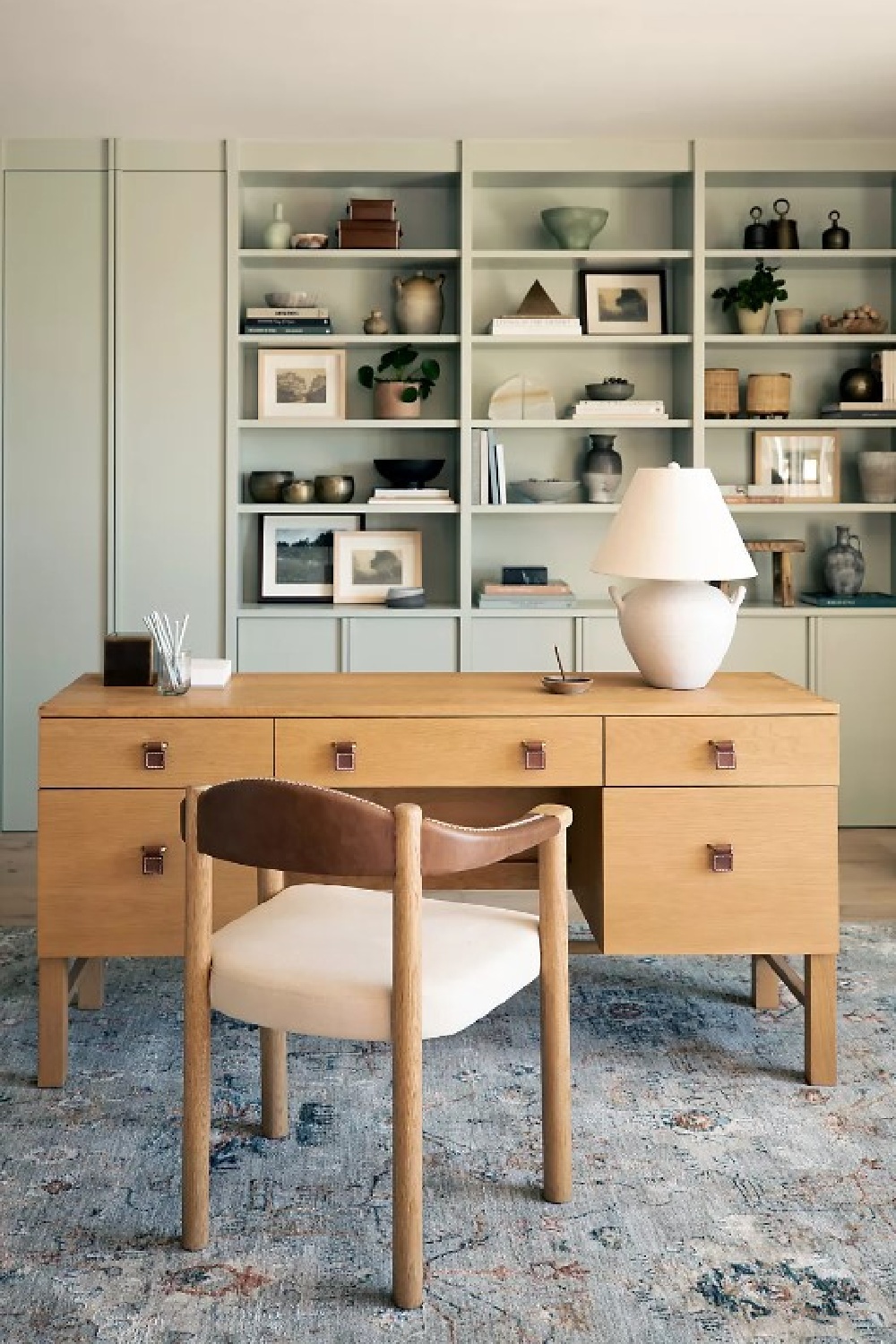 Creative workspace with warm natural lighting and design tools